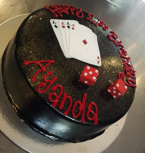 Wicked chocolate iced in black ganache, 3D fondant playing cards and dices