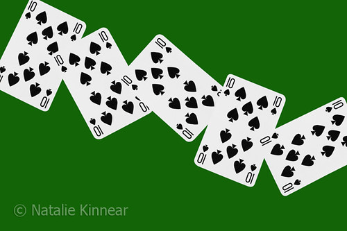 Playing Cards Ten of Spades on Green Background