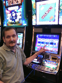 Me: waiting to get a stack of 19 $100 Bills as payoff of Monopoly Slot jackpot